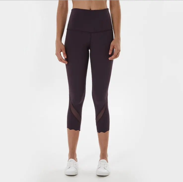Dark purple cropped yoga leggings with high waistband and mesh knee panels