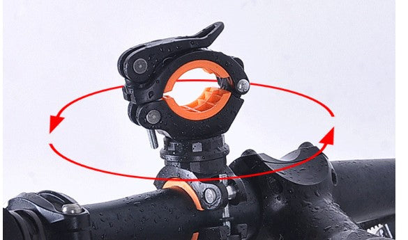Black bike light mounting bracket with orange inner rings on handlebar
