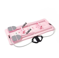 Pink compact Pilates sliding board with gray foot pads and black rope strap handles