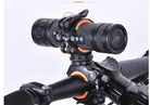 Black bicycle light mounting bracket on handlebar with orange inner ring accents