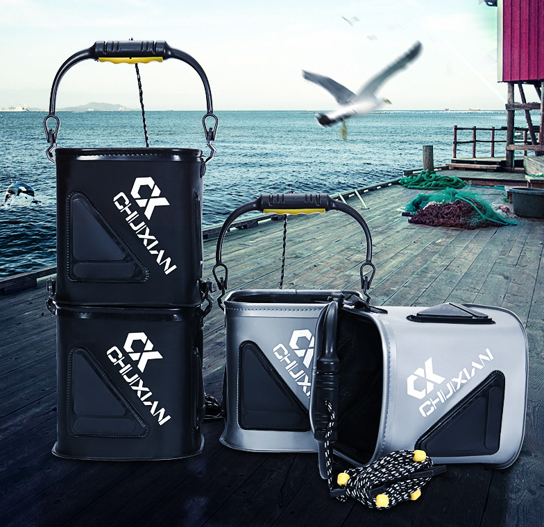 Two collapsible fishing water buckets, black and gray, with carry handles and front logo