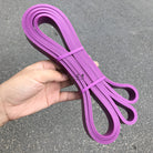 Purple latex resistance loop band, multi-loop pull-up band held in hand