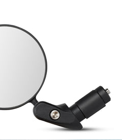 Convex bike rearview mirror close-up with black clamp and round glass