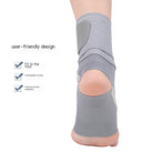 Gray ankle support brace with compression wrap around the heel and ankle.
