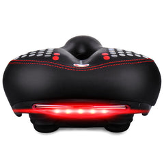 Black bike saddle with red safety light strip and neon dotted accents