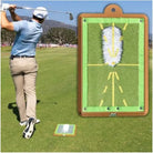 Green target practice board with yellow swing guide lines on a mat