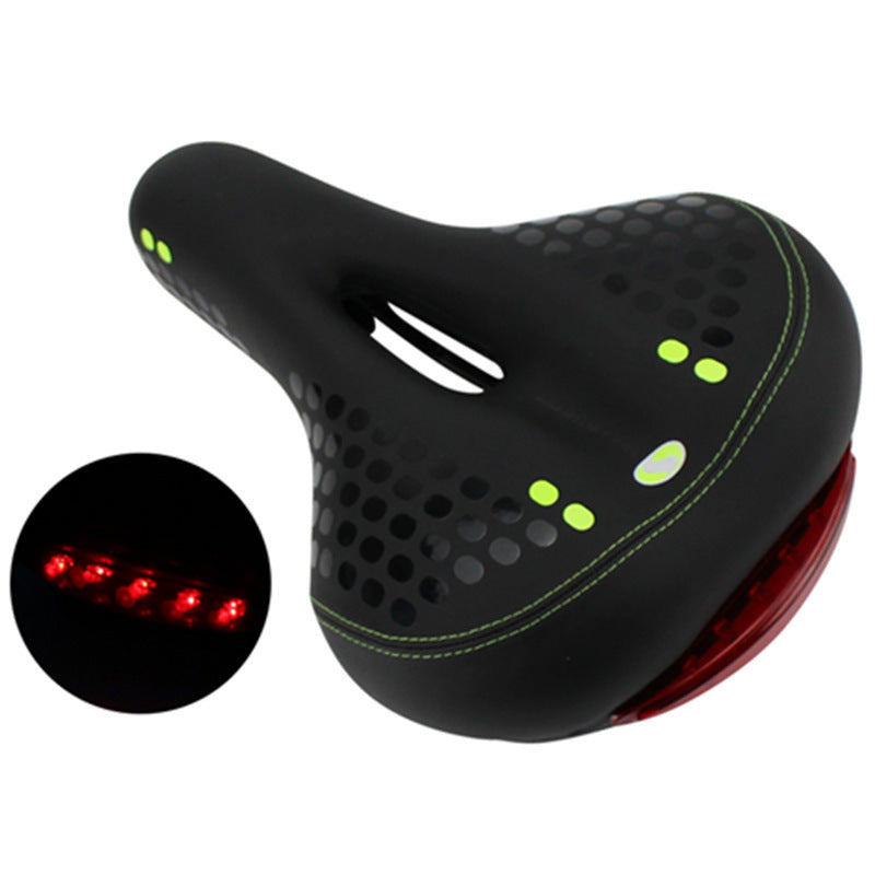 Black gel bike saddle with neon green accents and red rear safety light