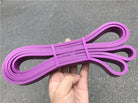 Pink latex loop resistance bands with two end loops and tied center wrap.