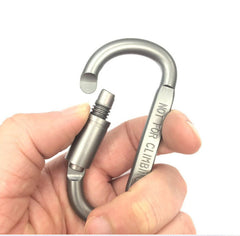 Silver aluminum carabiner clip held in hands with spring latch and gate