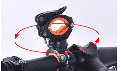 Black bike light mounting bracket with orange inner rings on handlebar