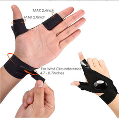 Black LED flashlight glove on hand, wrist strap and round control light