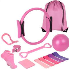 Pink yoga resistance ring with bands, straps, and a drawstring carry bag