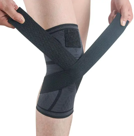 Black removable knee brace with cross wrap strap and contoured padding panel