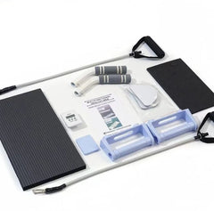 Compact sliding board set with black base mat, straps, pads, and resistance bars