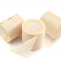 Sports athletic tape rolls with beige skin-tone sponge strip for cushioning