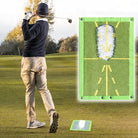 Green golf practice swing training mat with yellow target lines and arrows