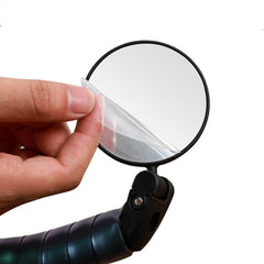 Bike rearview mirror with clear protective film being peeled off the glass