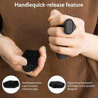 Black spring hand trainer on fingers with textured suction-style grip pad
