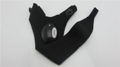 Pair of black LED flashlight gloves laid flat with round light module