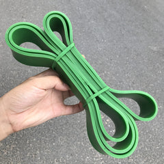 Bright green latex loop resistance bands with two end loops and bundled stack.