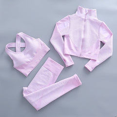 Women's lavender fitness set: zip mock-neck jacket, sports bra, high-waist tights.