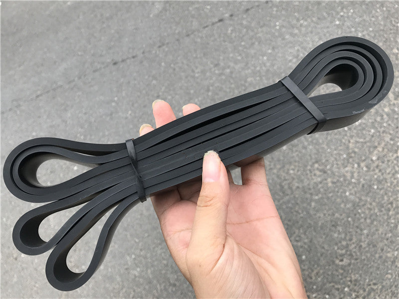 Black latex loop resistance bands with two end loops and tied center wrap.