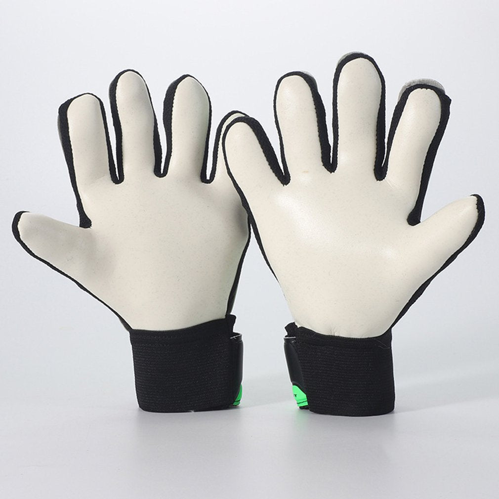 Kids white goalkeeper gloves with black wrist strap and small green trim, textured finger grips