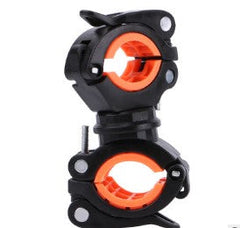 Black bicycle light mounting bracket with orange inner rings, angled view